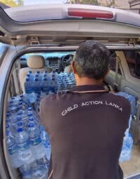 man-with-water-bottles